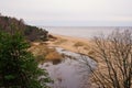 View from white dune where river flows to the sea