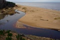 View from white dune where river flows to the sea