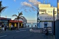 View of the white houses with blue shutters on the background of the oceans on the Spanish island of Furertaventra