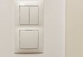 View of white light switch pair on wall . Building construction elements concept. Interior. Royalty Free Stock Photo