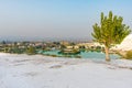 View from white mountain Pamukkale to city and lake at foot of hill in Turkey. Royalty Free Stock Photo