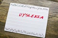 View of White Penmanship Board with a Red Dyslexia Written in Marker