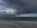 View on white sandy Corallejo beach, Atlantic ocean water and kite surfers at winter Royalty Free Stock Photo