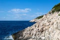 View on white stone shore of an island