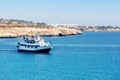 A view of white touristic ship in azzure water of the Mediterranean Sea, Cyprus.