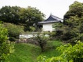 View of the white tower of former Edo castle across Ushigafuchi moat in summer