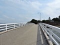 View of white wooden bridge across Baltic sea on the island Sveaborg in Finland