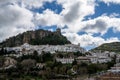 View of the whitwashed Andalusian village of Zahara de la Sierra and its Moorish Castle on the hilltop