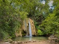 View of wild waterfall (Cascata di Fossi) near Genga in the green wood