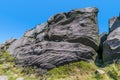 A view of a wind eroded rock beside the path on the summit of the Roaches escarpment, Staffordshire, UK