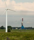 View of wind farm or wind park, with high wind turbines for generation electricity. Green energy concept