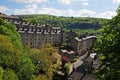 A view of the winding streets and tall stone houses in hebden bridge se in the surrounding west yorkshire countryside