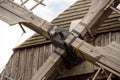 a windmill with its large drive shaft and the windmill vane