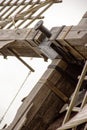 a windmill with its large drive shaft and the windmill vane