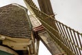 a windmill with its large drive shaft and the windmill vane