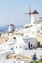 View at windmills in Oia, Santorini, Greece, just before sunset Royalty Free Stock Photo