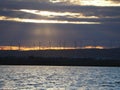 View of the windmills wind turbines near salt lake near Larnaka durign sunset winter holiday