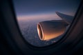 Airplane during night flight above ocean Royalty Free Stock Photo