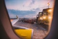 The view from the window of the airplane porthole at dawn at the airport of Barcelona. Theme of romance on a journey. Tourism and Royalty Free Stock Photo