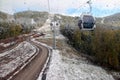 View from the window of the cableway cabin. Mountain landscape in Manzherok. A cable car on a blue sky background. Drops on the gl Royalty Free Stock Photo