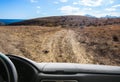 view from the window of the car on the dirt road of the mountain Royalty Free Stock Photo