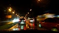 View from the window of a car driving fast along the  street of a night city. Royalty Free Stock Photo