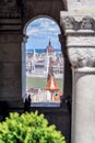 View through a window in the fishermen`s bastion to the parliament building.
