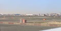 View from the window of a Flydubai aircraft moving along the runway to the standing planes of world airlines and the airport Royalty Free Stock Photo