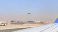 View from the window of a Flydubai aircraft moving along the runway to the standing planes of world airlines and the airport Royalty Free Stock Photo