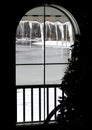 view through window at frozen river with christmas tree next to it Royalty Free Stock Photo