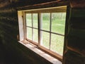 View through the window from inside the Ranger Cabin on the Baldy Mountain hiking trail in Duck Mountain Provincial Park, Manitoba Royalty Free Stock Photo