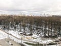 The view from the window of the old city cemetery in the park from a height with trees and houses in the winter. Royalty Free Stock Photo