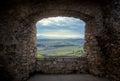 Landscape view through the window of a medieval castle. Royalty Free Stock Photo