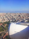 View from the window of the plane to the city of Lisbon and Portugal. Clear blue sky, aircraft engine and wing Royalty Free Stock Photo