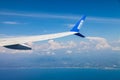 view from the window of the plane on the wing of the scat airline of kazakhstan against the backdrop of the blue sea, sky and Royalty Free Stock Photo