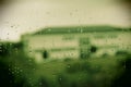 view from the window after the rain.  raindrops on the glass.  building in the background Royalty Free Stock Photo