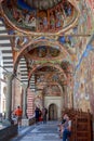 RILA MONASTERY, BULGARIA - JULY 15, 2018. View of outer corridor with frescos of Rila Monastery Royalty Free Stock Photo