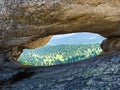 View through a window in the rock in the Natural Park Ergaki