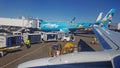Busy airport jetway gate with airplanes loading-unloading