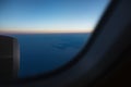 View from the window to airplane engine on runway of airport. Above the sky, on sunrise Royalty Free Stock Photo