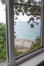 View from the window to the beach and the sea, the concept of a budget trip Royalty Free Stock Photo