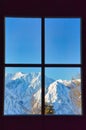 View through window to snowy mountains, Alps, Austria Royalty Free Stock Photo