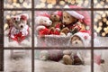 View through window to teddy bear family celebrating christmas