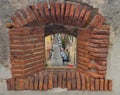 View through the window in the wall of the fortress on the city Royalty Free Stock Photo