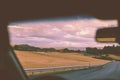 Driving a car on a mountain road during sunset Royalty Free Stock Photo