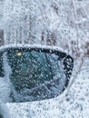 view of the winter landscape from the car window. the side mirror is visible Royalty Free Stock Photo