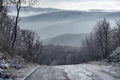 Winter road uphill in the mountains