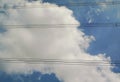 View of wires crossing the blue sky white clouds Royalty Free Stock Photo