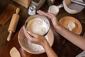 Woman Hand Sifting Bread Flour Before the Process of Kneading Dough