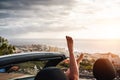 View of woman legs inside convertible car during a road trip - Young girl having fun traveling in cabriolet car in summer vacation Royalty Free Stock Photo